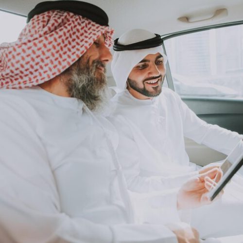 men-wearing-dish-dash-traveling-car_1048944-2079835